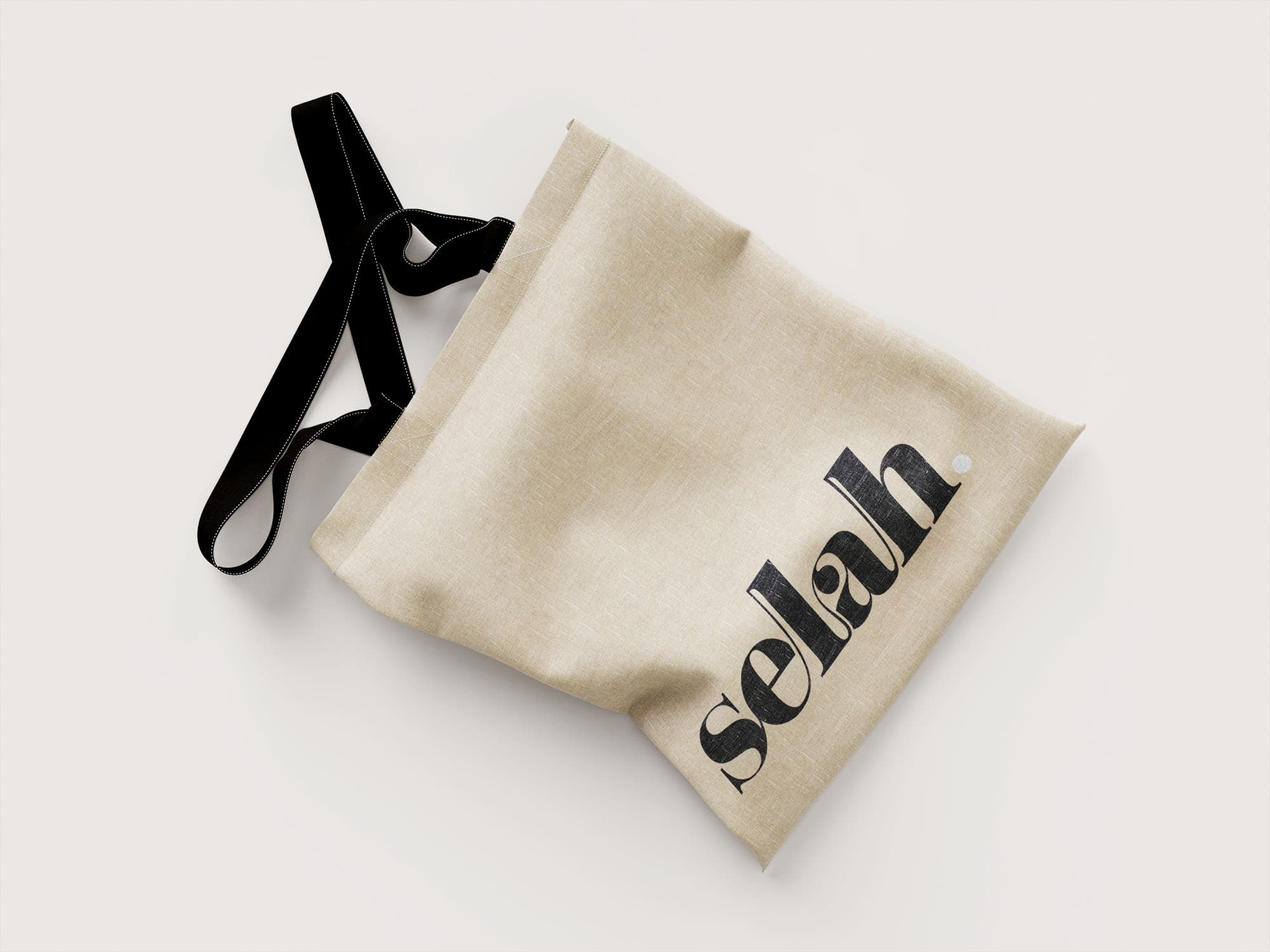 Selah logo presented on a tote bag mockup. This logotype was created by customising one of One Church's branding fonts.