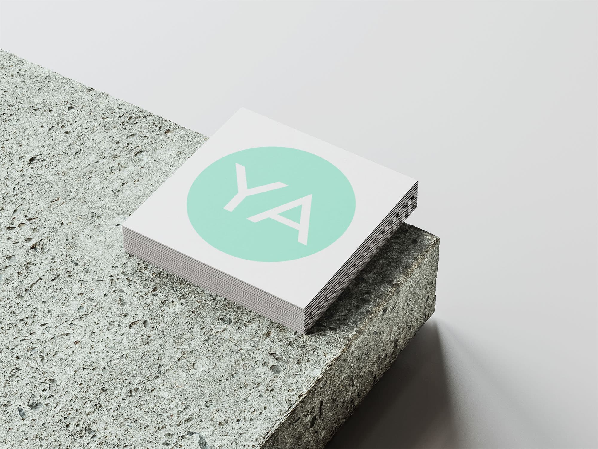 Logo for One Church's young adults ministry, 'YA', shown on a square business card.