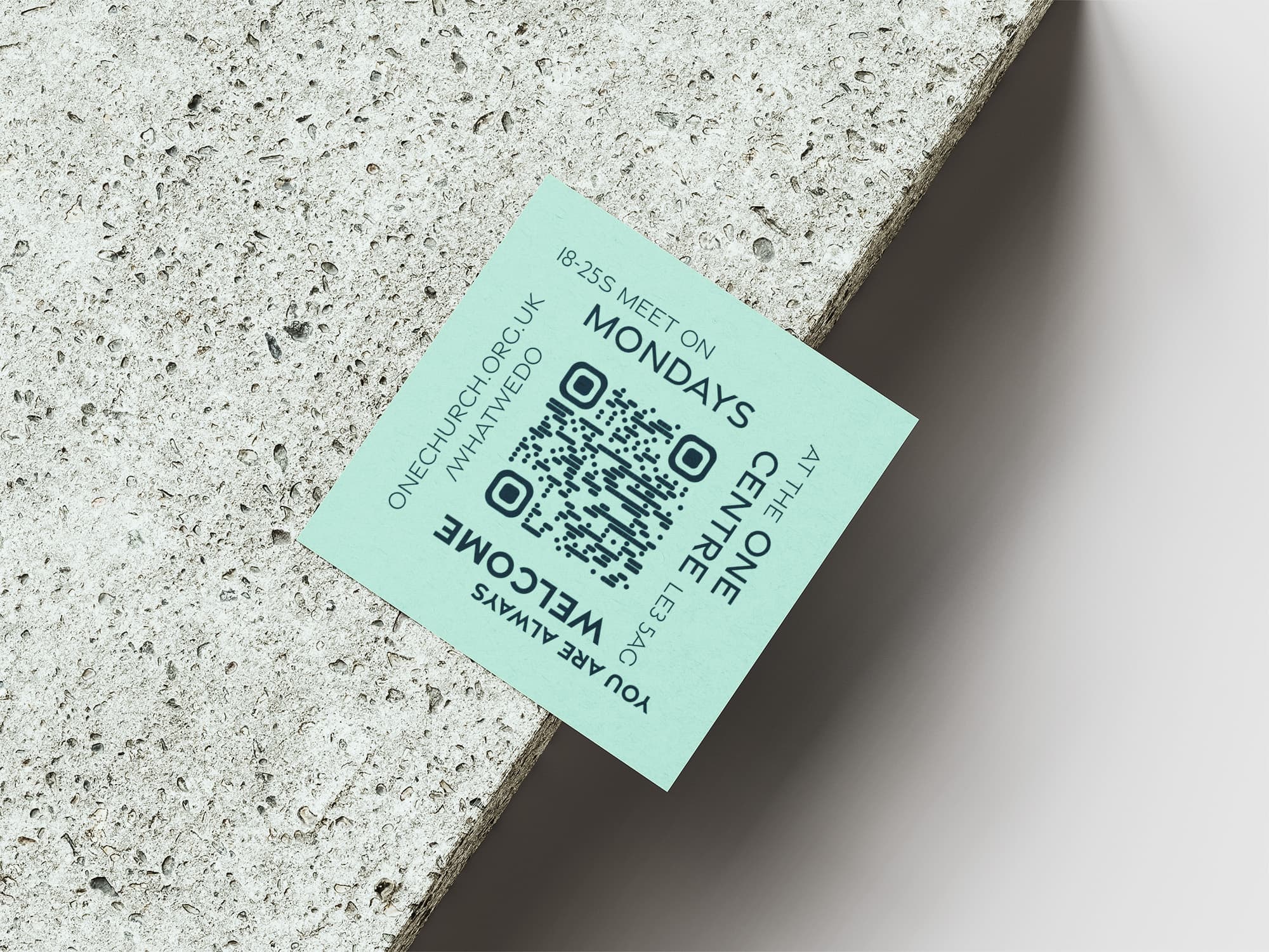 Reverse side of the YA business card with QR code and key information.